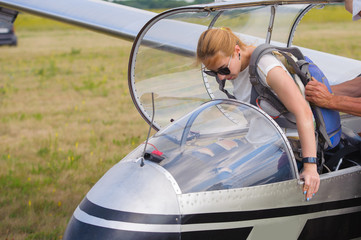Woman in glider waiting for flight