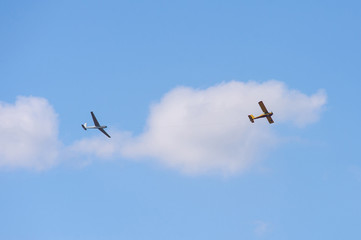 Sailplane and a towing aircraft starting on an airfield