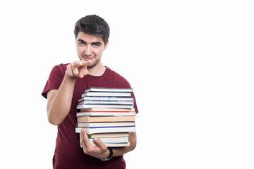 Student holding pile of books showing watching you