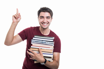 Student holding pile of books having good idea