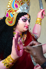 Artisan of West Bengal making clay idol of Godess Durga ahed of Durga festival