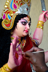 Artisan of West Bengal making clay idol of Godess Durga ahed of Durga festival