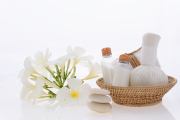 Obraz na płótnie Canvas Bath products and skincare treatment with Plumeria spa flower on white background