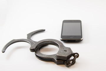 unlocked phone. phone with unlocked handcuffs on white background