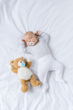 baby sleeping with toy