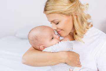 mother holding infant