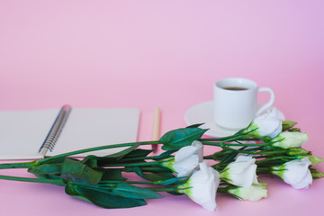 Branch of flower on background of cup of coffee