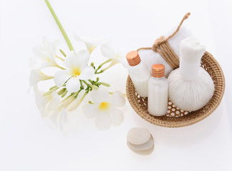 Bath products and skincare treatment with Plumeria spa flower on white background