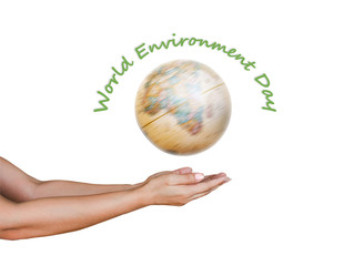 World environmental day with spinning globe and hand holding on white background