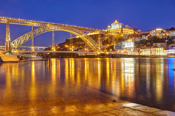 Fototapeta na wymiar Dom Luis I Bridge over Douro river and Serra do Pilar
