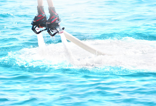 Flyboarding and seariding in a sunny summer day