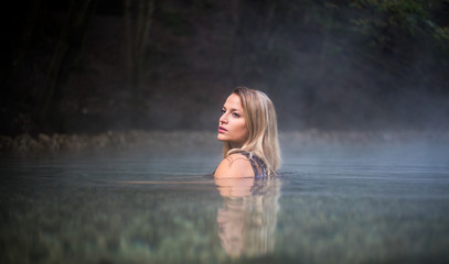 Young Woman Taking a Bath In Hot Spring Outdoor Maibachl Villach Austria