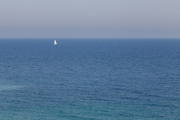 Fototapeta na wymiar Sailboat navigating on Black Sea