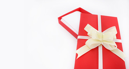 red gift box with bow on white background