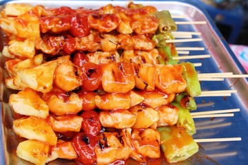 Grilled pork barbecue topped with sauce is delicious