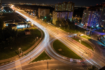 Fototapeta na wymiar Lights trail on a highway in Dolgoprudny city, Moscow region