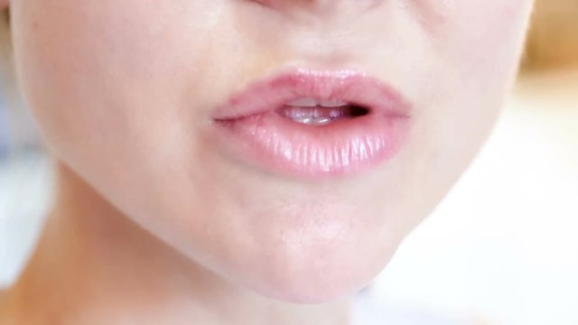 Close-up of female lips with clean lipstick make up. macro lipgloss make-up
