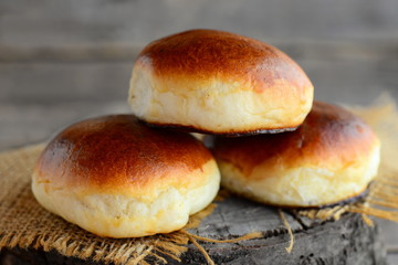 Delicious baked patties. Homemade baked patties in the oven. Yeast dough pastry. Closeup