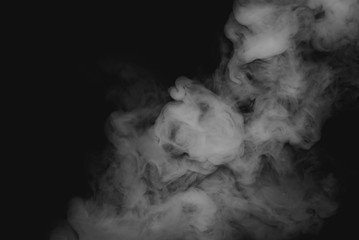 Dense white smoke isolated on black background