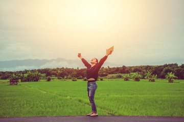 Asian women relax in the holiday. Write a study of natural garden garden.