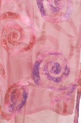 Close up view of a pink scarf made by felting wool and silk