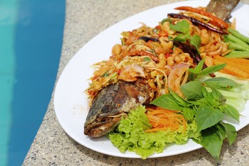 Fried snapper spicy mix vegetable is delicious