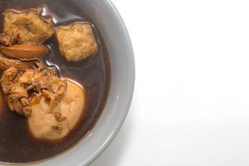 Eggs boiled stewed in the gravy on white background