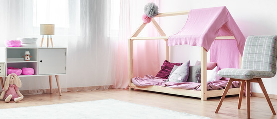 Cozy monochromatic interior of a bedroom