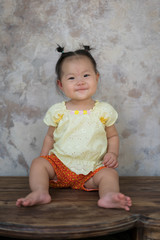 Baby girl with Thai traditional dress.