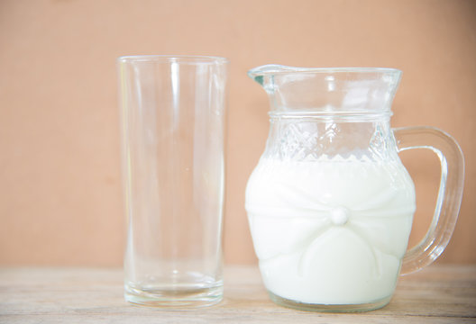 milk in glass on table.