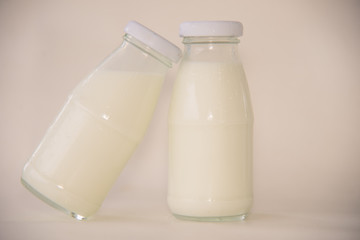milk in glass on table.