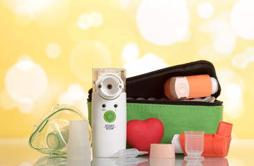 Medical equipment for inhalation, respiratory mask on yellow