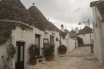 Street of Alborobello town in Italy, Puglia region. Winter season.