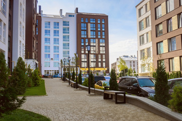 Beautiful new modern residential complex. White and brown houses in a modern style.