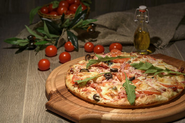Delicious fresh pizza served on wooden table