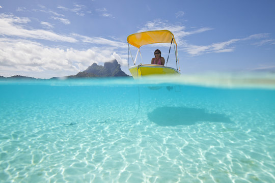 Oceania, Bora Bora, tourist in moored boat
