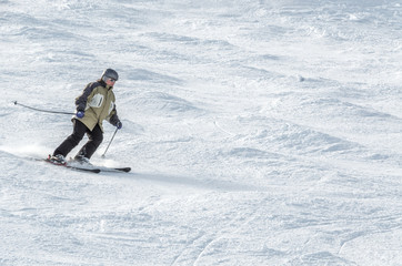 Fototapeta na wymiar Skier on the descent from the mountains