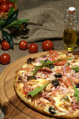 Delicious fresh pizza served on wooden table