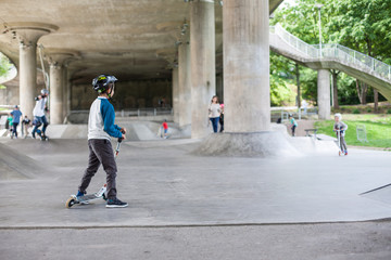 Powerful funny young guys are trained in a skate park