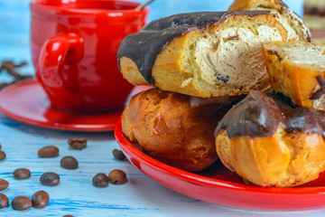 Coffee, waffles and cakes on a wooden background