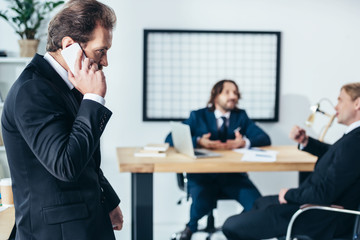 businessman talking on smartphone