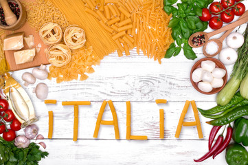 Italian pasta ingredients for Bolognese on white wooden table, top view