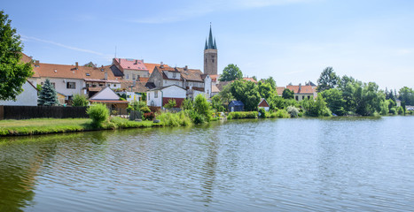 Fototapeta na wymiar Beautiful l scenic views of lake in telc in czech republic with reflected city