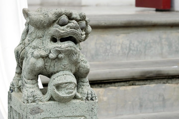 Fototapeta na wymiar Leo statue on the stairs of the temple according to faith