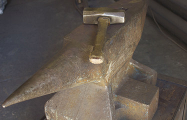 Old hammer and rusty anvil