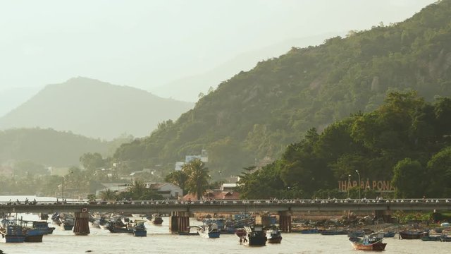 Old cham towers, bridge and boats in Nha Trang, Vietnam