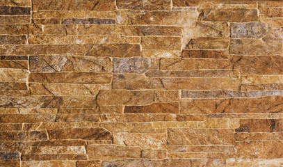 The texture of the stone of the facade . Lining material