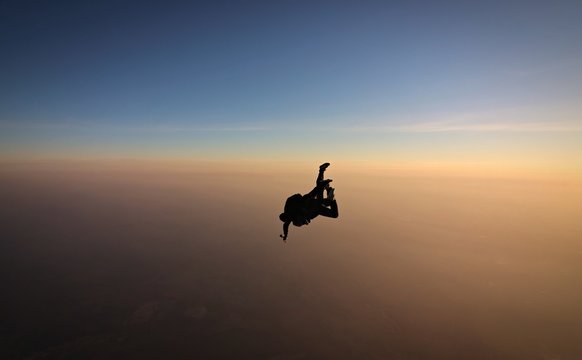 Skydiving tandem sunset with soft focus on the background