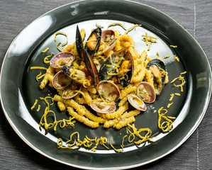 dry passatelli with shellfish and lemon bark strips