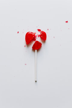Isolated broken heart shaped candy on a white background